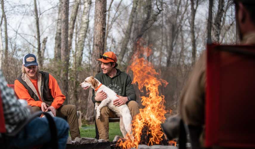 bird hunters at a hunting camp fire